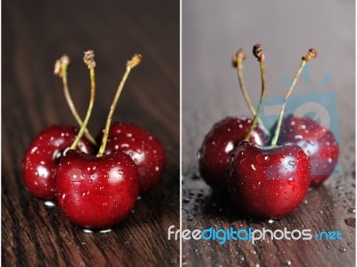 Cherries On Wooden Table With Water Drops Stock Photo