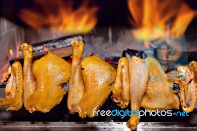 Chicken Roasting On Skewer Stock Photo