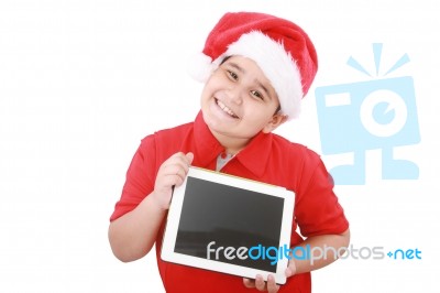 Child With Santa Hat And Tablet Pc Stock Photo
