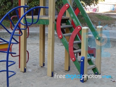 Children Playground, Swing Near The House  Stock Photo