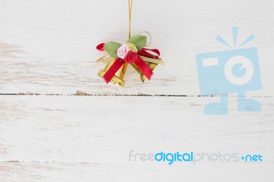 Christmas Bells On Wooden Floor Background  Stock Photo