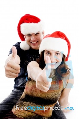 Christmas Couple Showing Thumbs Up Stock Photo