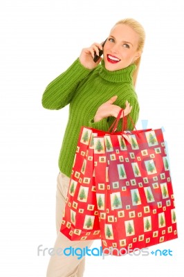 Christmas Shopper On Phone Stock Photo