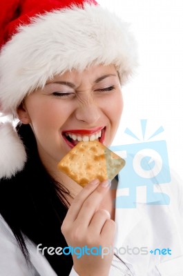 Christmas Woman Eating Biscuit Stock Photo