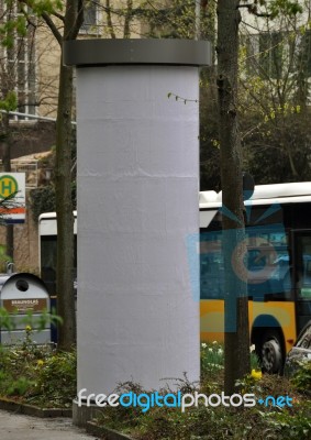 City Scenery - Advertising Pillar With Traffic Stock Photo