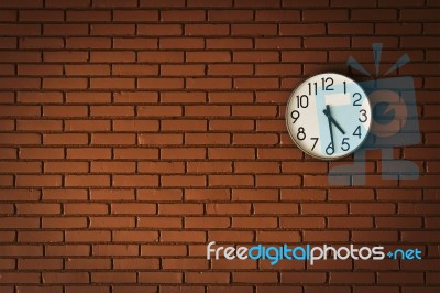 Clock On Brick Wall Stock Photo
