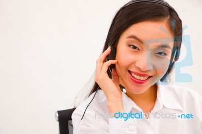 Close-up Of A Young Smiling Female Customer Service Executive Stock Photo