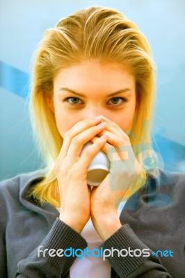 Close-up Of Blonde Young Woman Drinking Tea Stock Photo