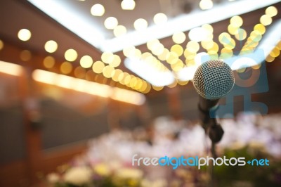 Close Up Of Microphone In Concert Hall Or Conference Room Stock Photo