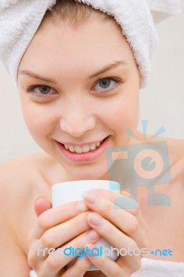 Close-up Of Smiling Woman In Spa Holding Cup Stock Photo