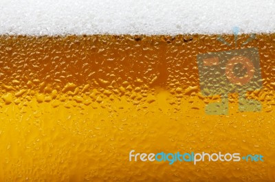Close-up Picture Of A Beer With Foam And Bubbles Stock Photo