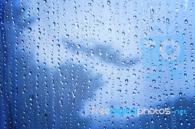 Close Up Texture Of Water Drop Background On Blue Mirror Use As Stock Photo