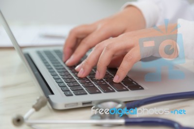 Closeup Of Business Woman Hand Typing On Laptop Keyboard Stock Photo