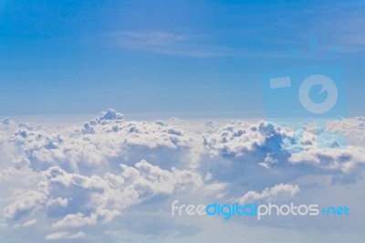 Clouds And Sky Blue, Viewed From An Airplane Window Stock Photo