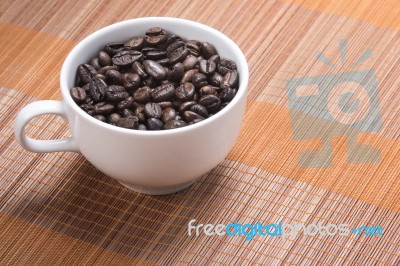 Coffe Bean In Cup Stock Photo