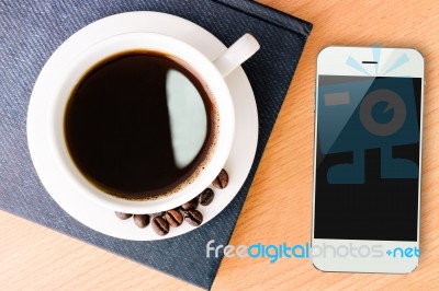 Coffee And Smartphone Mobile On Wood Table Stock Photo