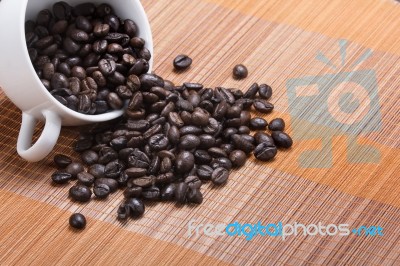Coffee Bean Cup Spill Over Stock Photo