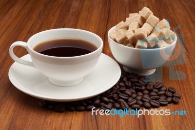 Coffee Cup And Saucer On A Wooden Table Stock Photo