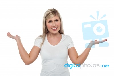 Confused Young Woman. Mixed Expression Stock Photo