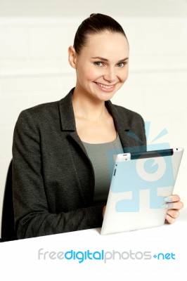 Corporate Lady Using Wireless Tablet Device Stock Photo