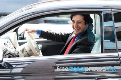 Corporate Man Driving His Car Stock Photo