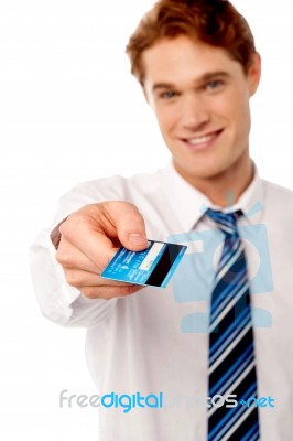 Corporate Man Offering You Credit Card Stock Photo