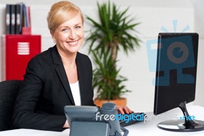 Corporate Woman Typing On Keyboard Stock Photo