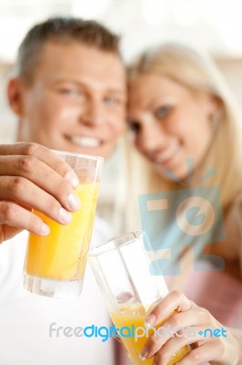 Couple Drinking Orange Juice Stock Photo