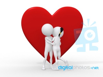 Couple Embracing Against A Big Red Heart Stock Image