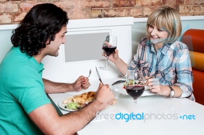 Couple Enjoying Dinner At A Restaurant Stock Photo