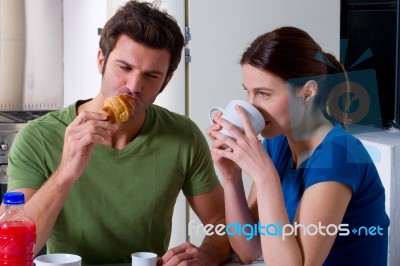 Couple Having Tea And Snacks Stock Photo