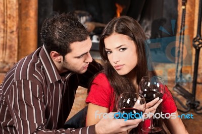 Couple In Love Near Fireplace Stock Photo