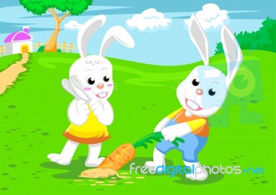 Couple Rabbits And Big Carrot Stock Image