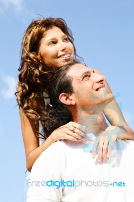 Couple Smiling And Looking Away Stock Photo