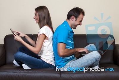 Couple Surfing The Internet Stock Photo