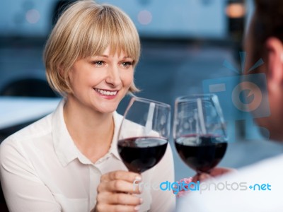 Couple Toasting In A Restaurant Stock Photo
