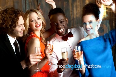Couples Enjoying Champagne Or Wine At A Party Stock Photo
