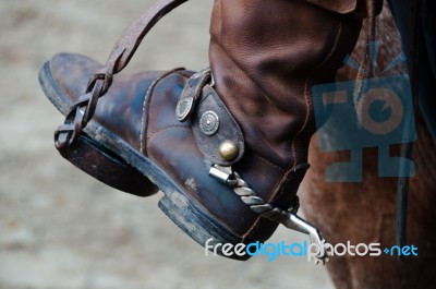 Cowboy Boot With Spur And Horse Stock Photo