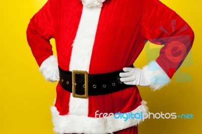 Cropped Image Of Santa Resting His Hands On Waist Stock Photo