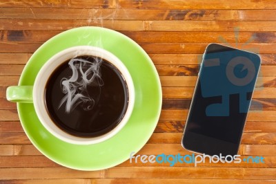 Cup And Smartphone Stock Photo