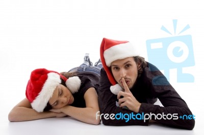 Cute Girl Sleeping And Guy Indicating For Silent Stock Photo