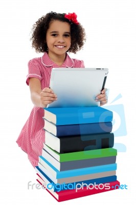 Cute Little Curly Haired Girl Using Tablet Pc Stock Photo