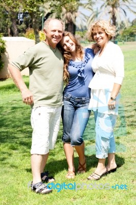 Daughter Posing With Her Parents Stock Photo