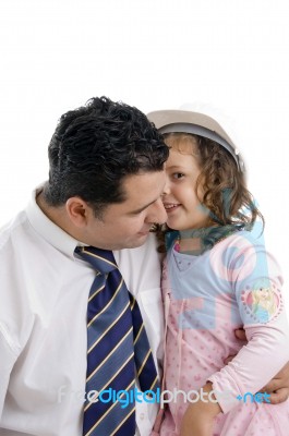 Daughter Whispering In His Father's Ear Stock Photo