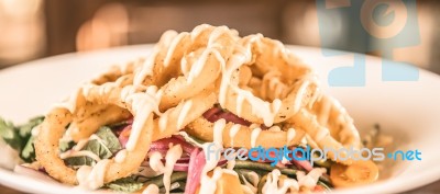 Deep Fried Calamari Rings And Salad Stock Photo
