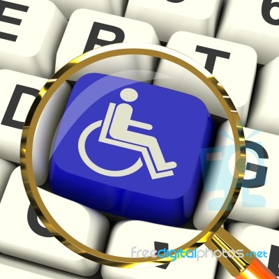 Disabled Key Magnified Shows Wheelchair Access Or Handicapped Stock Image