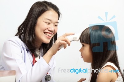 Doctor Checked Children Girl's Temperature Stock Photo