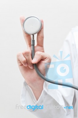 Doctor Holding Stethoscope Stock Photo