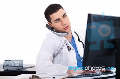 Doctor Logging His Notes In Computer Stock Photo