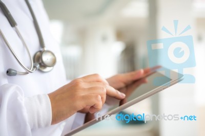 Doctor Using Tablet Computer Stock Photo